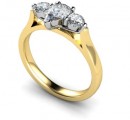 18 Carat Yellow and White gold Pear shaped Diamond, flanked by two Brilliant cut Diamonds